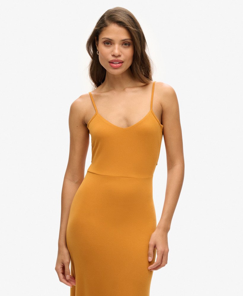 jersey jurk met open rug in erfgoed oker.