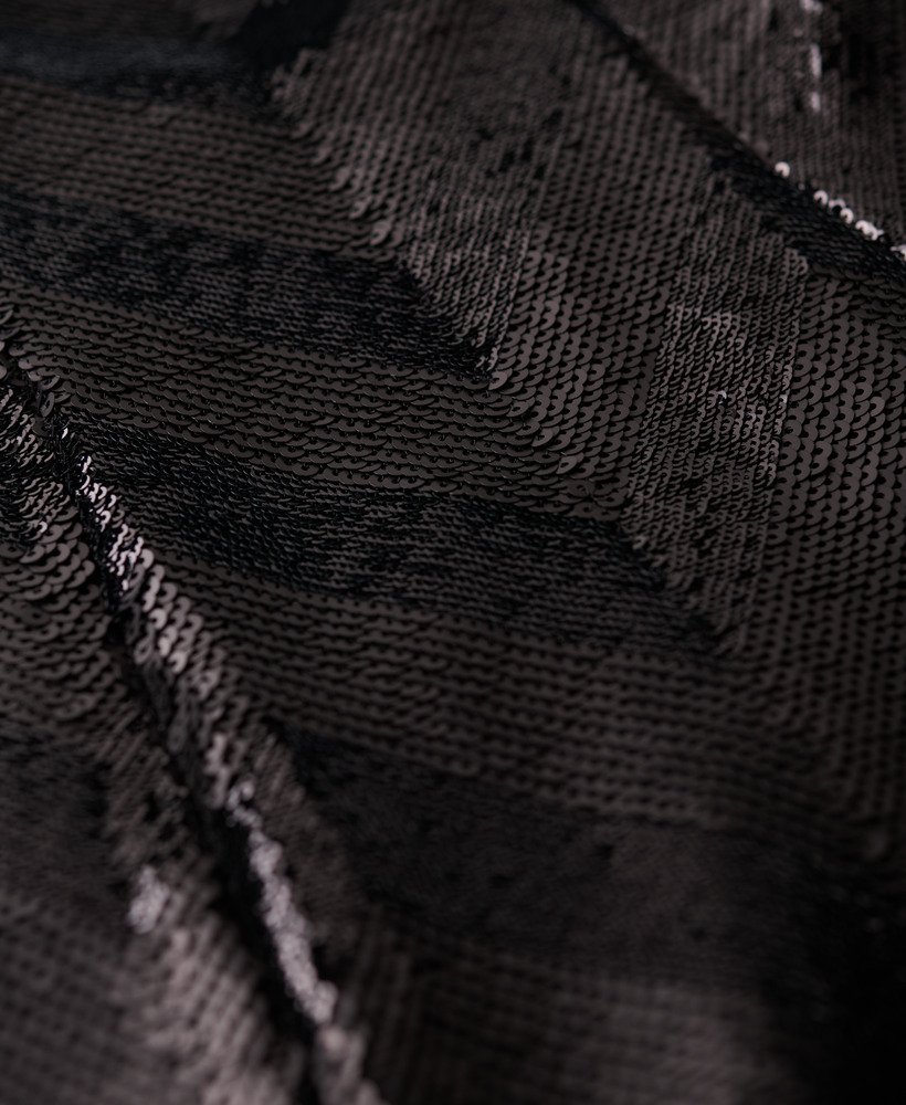 midi-jurk met chevronpatroon en open rug in zwart met art deco pailletten.