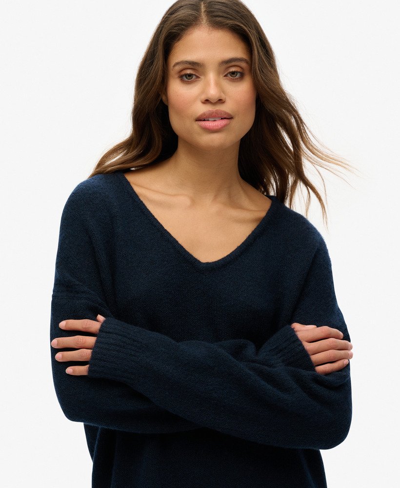 oversized v-hals jurk in donkerblauwgroen met een twist