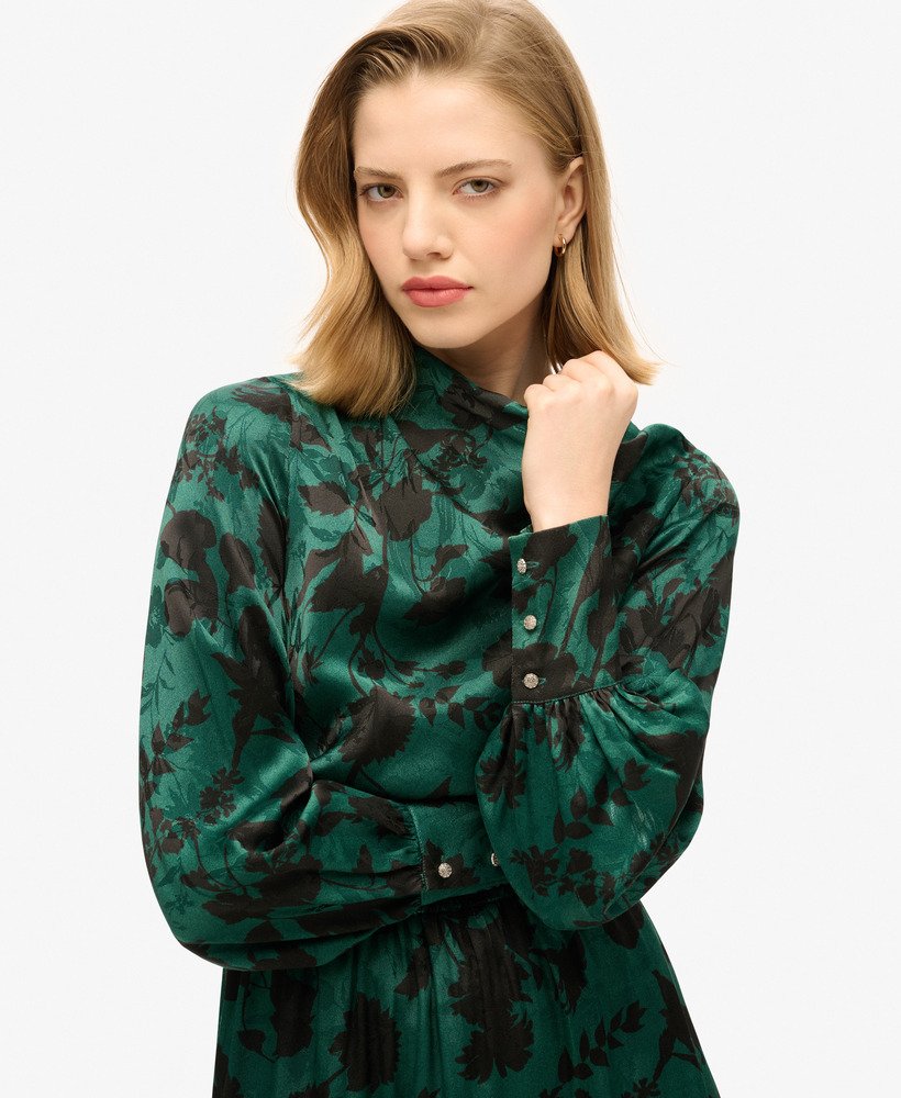 maxi jacquardjurk met colkraag in een turquoise bloemenprint.