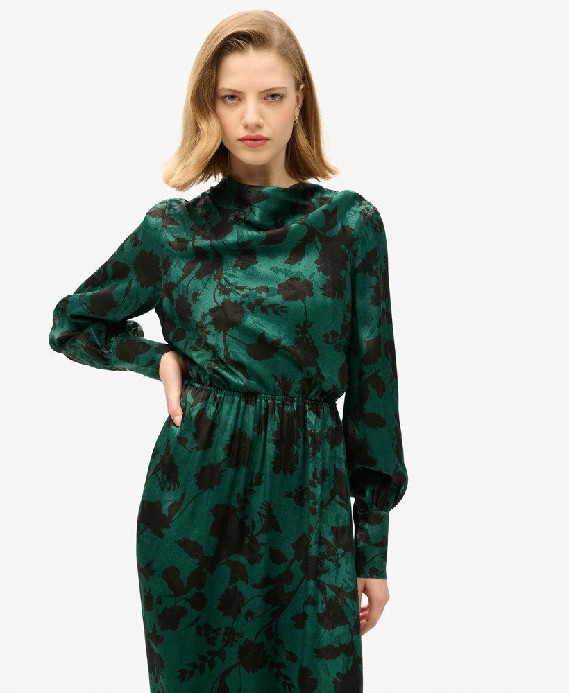 maxi jacquardjurk met colkraag in een turquoise bloemenprint.