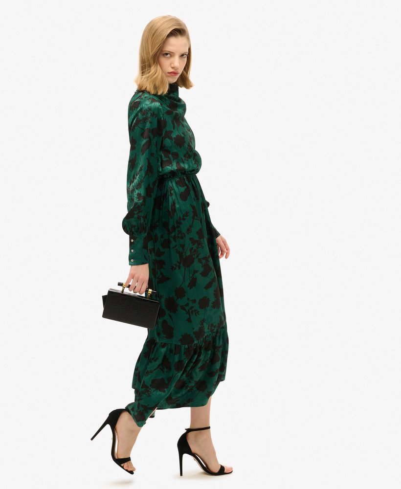 maxi jacquardjurk met colkraag in een turquoise bloemenprint.