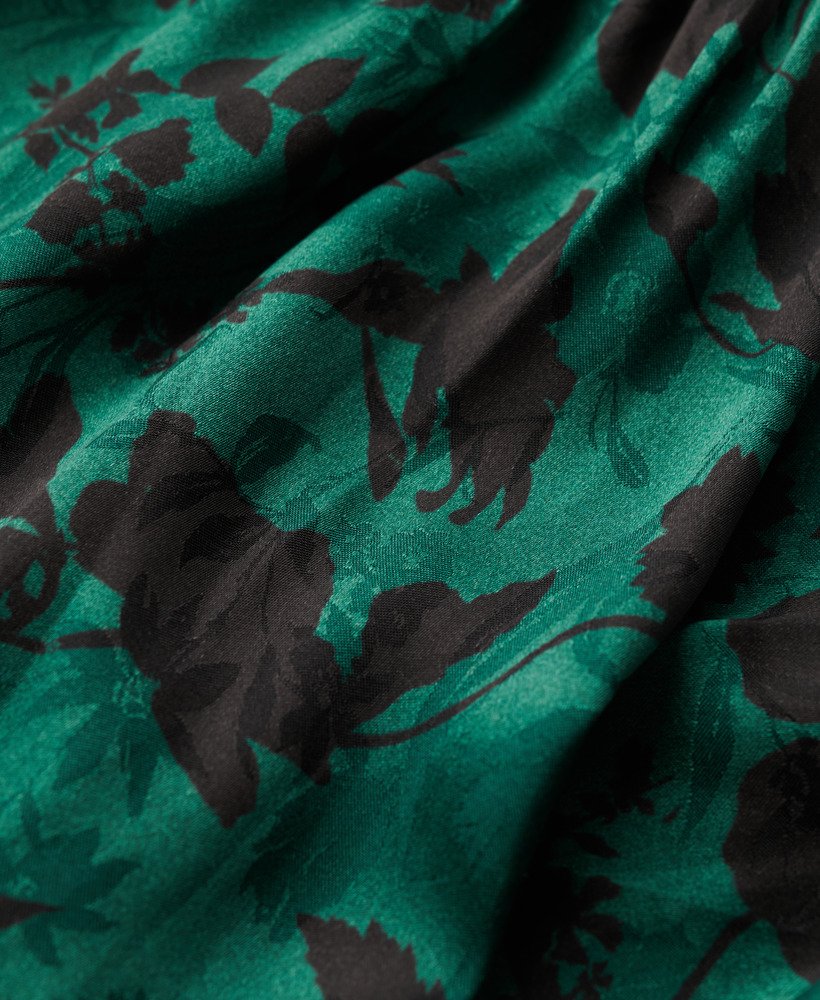 maxi jacquardjurk met colkraag in een turquoise bloemenprint.
