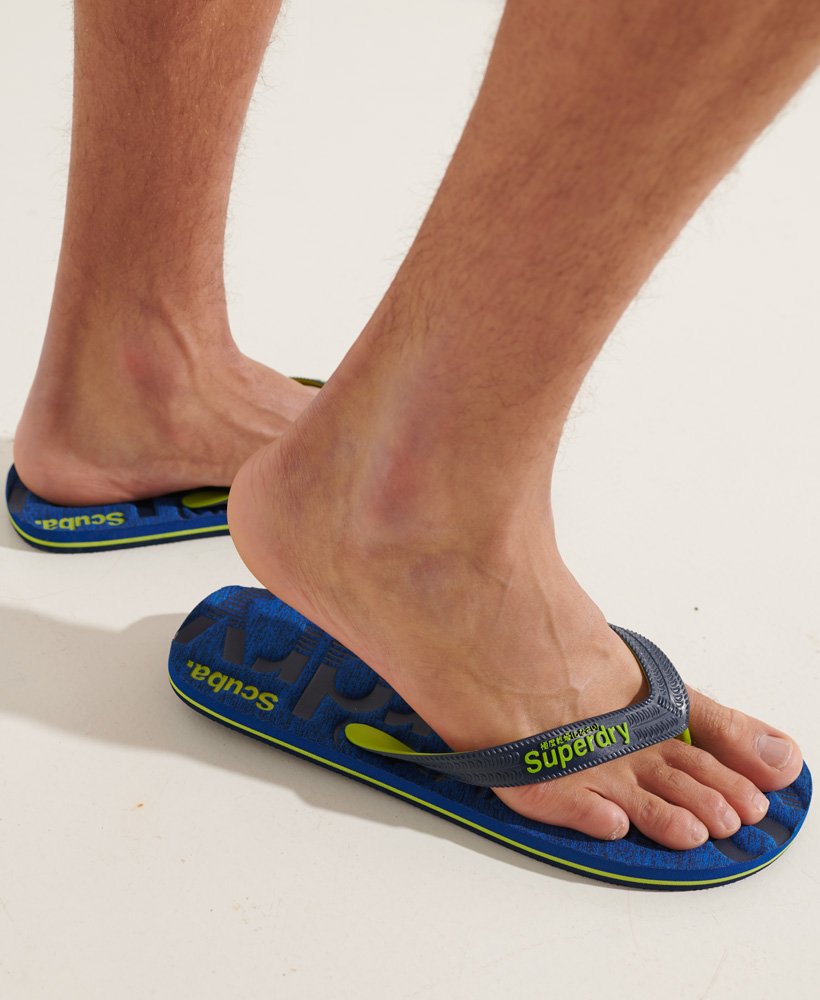 essential logo flip flops in cobalt grid