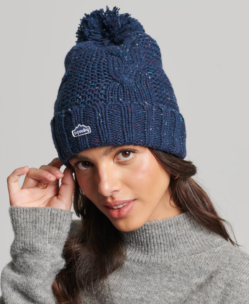 kabelgebreide muts met pompon in donkerblauw tweed