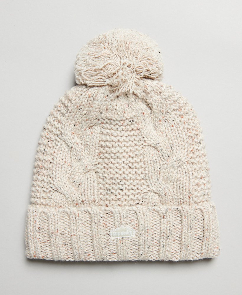 kabelgebreide muts met pompon in havermoutkleurige tweed