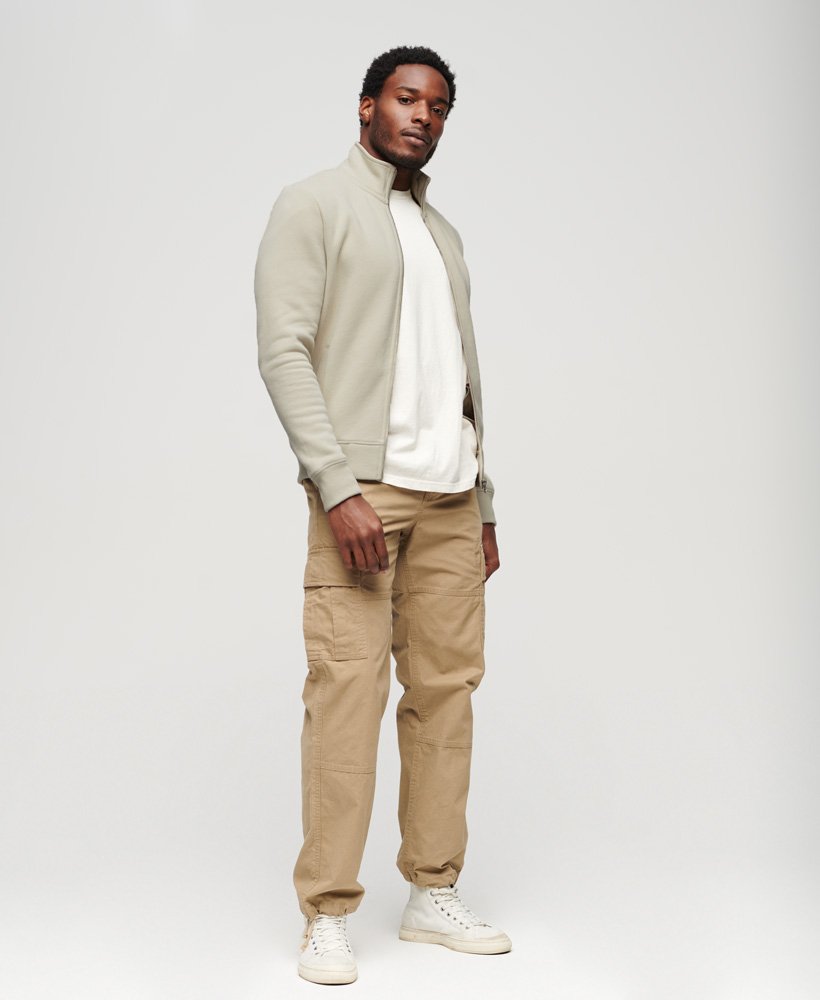 essential logo zip track top in light stone beige