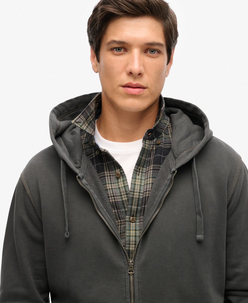 hoodie met contrasterende stiksels en relaxte ritssluiting in gewassen zwart.
