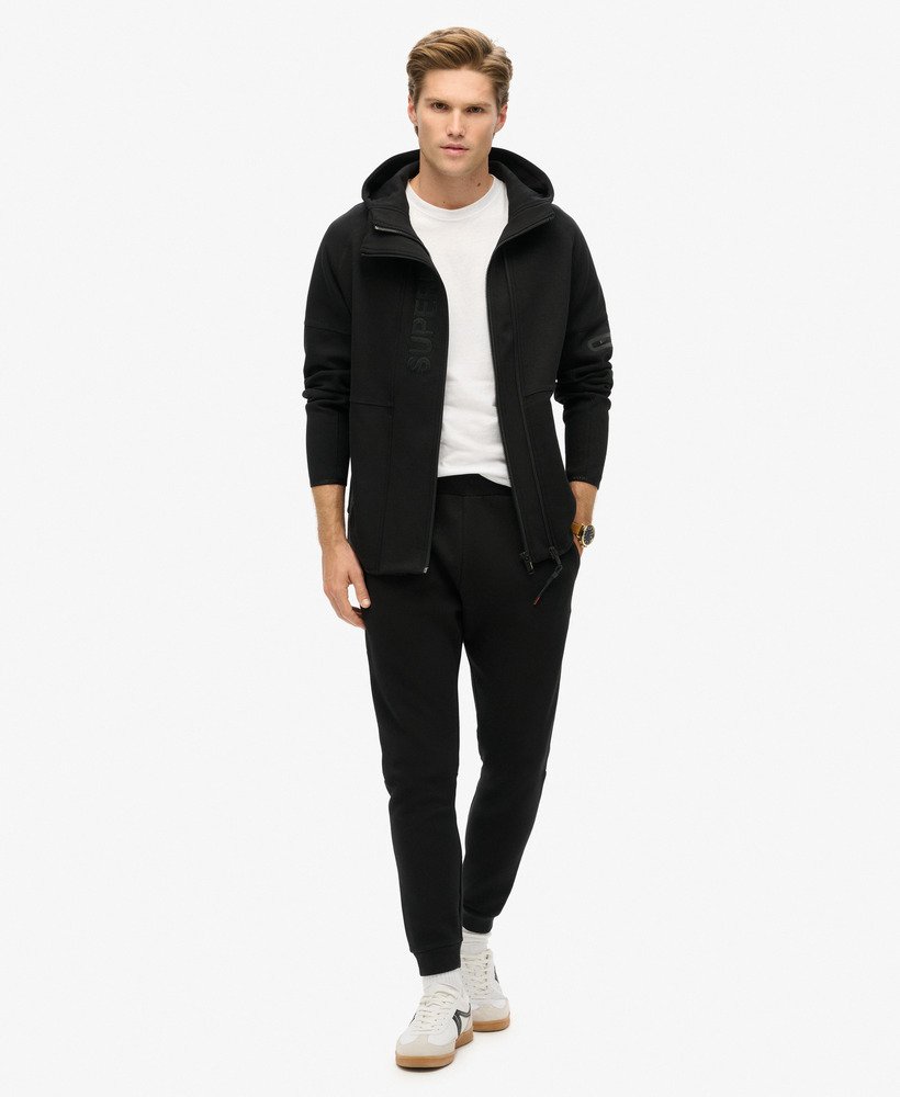 hoodie met losvallend tech-logo en ritssluiting in zwartoranje.