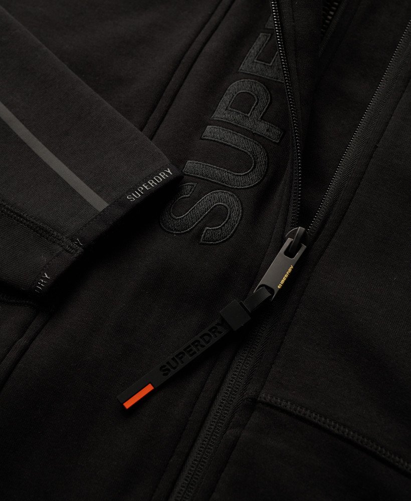 hoodie met losvallend tech-logo en ritssluiting in zwartoranje.