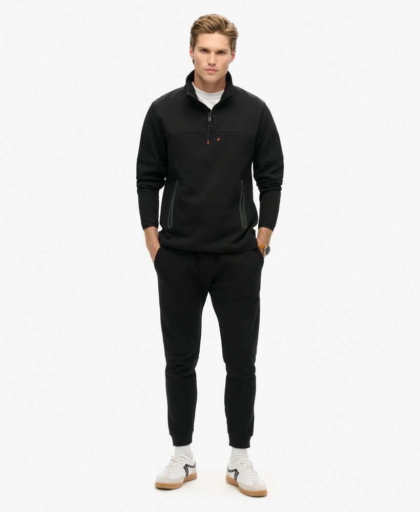 tech logo loose half zip in zwart