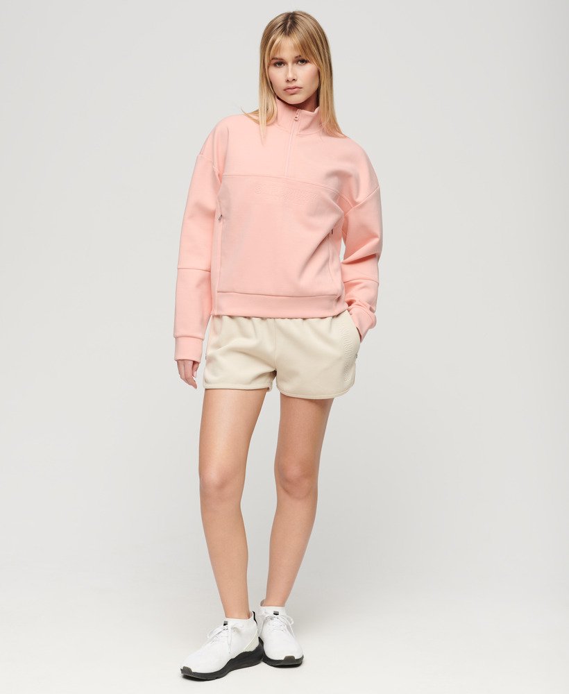 sport tech relaxed half zip in peach pearl pink