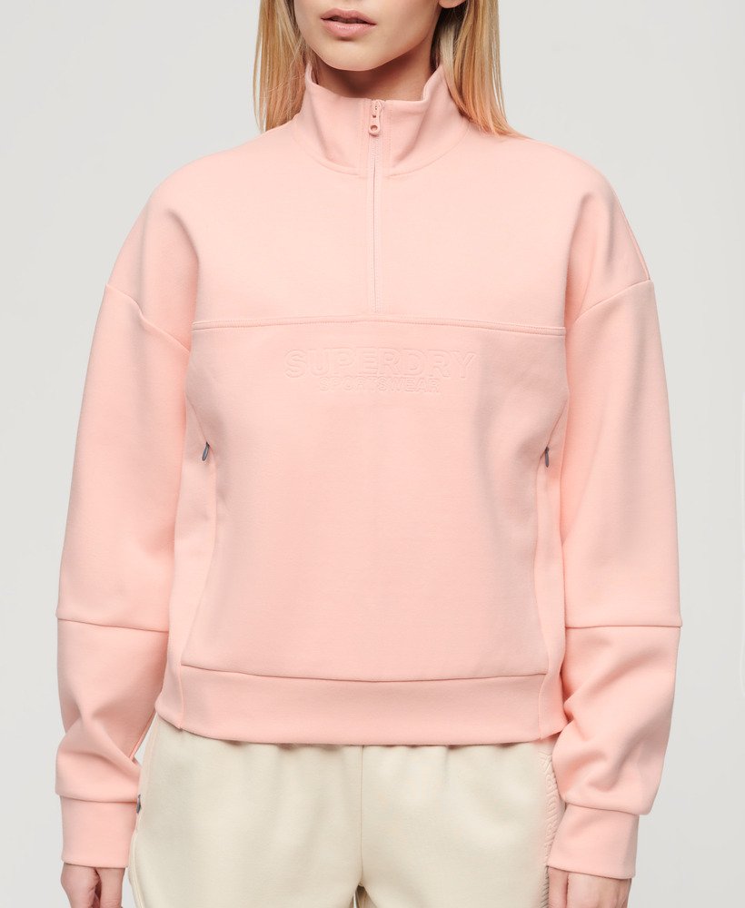 sport tech relaxed half zip in peach pearl pink