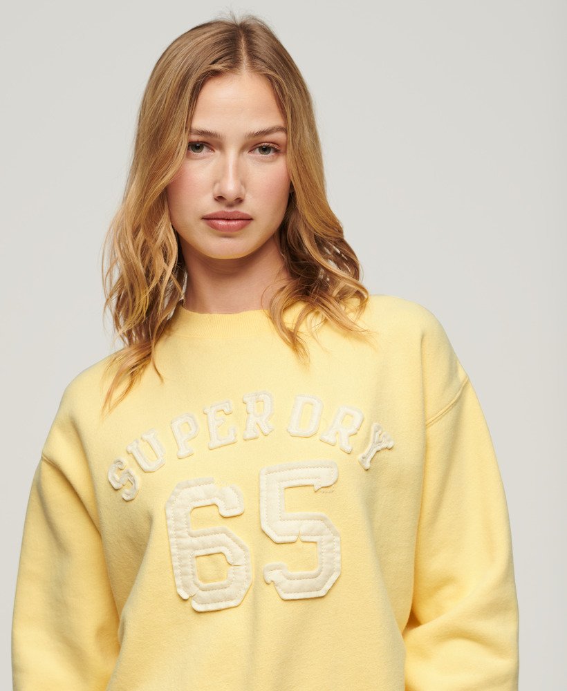 sportieve losse sweater met applicaties in lichtgeel
