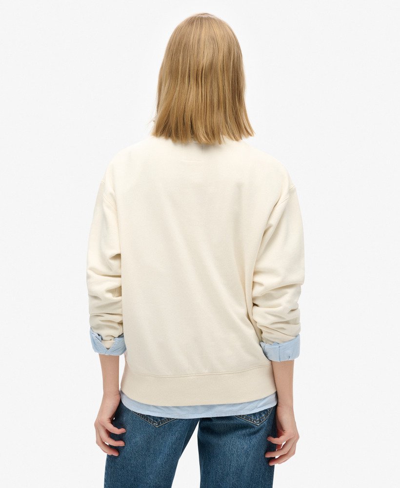 reissouvenir losvallende crewneck sweater in crème.
