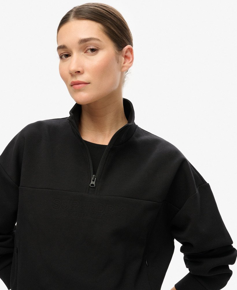 sport tech relaxed half zip sweatshirt in zwart