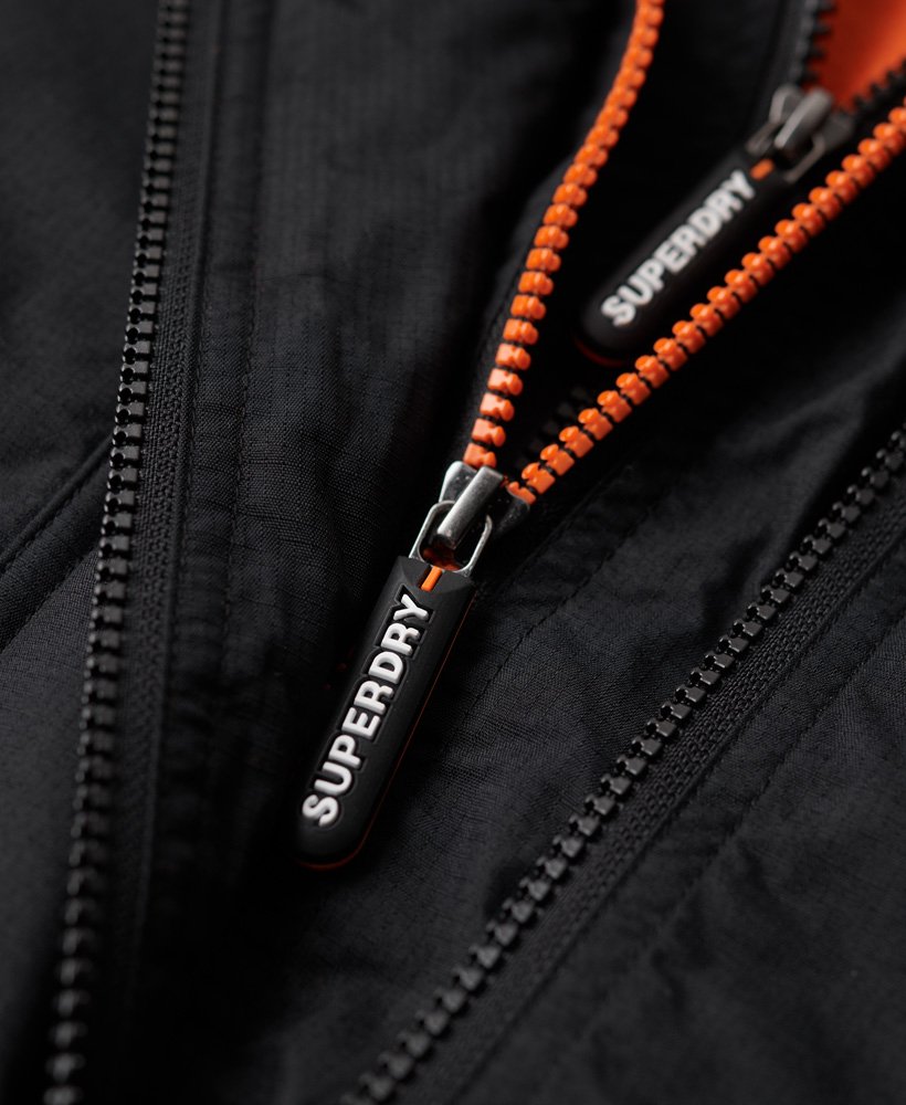 pop zip hood arctic sd-windcheater jacket in zwartfluororanje