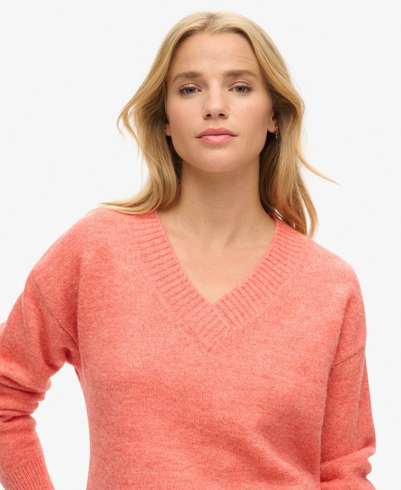 oversized v-hals trui in appeloranje gemêleerde kleur.