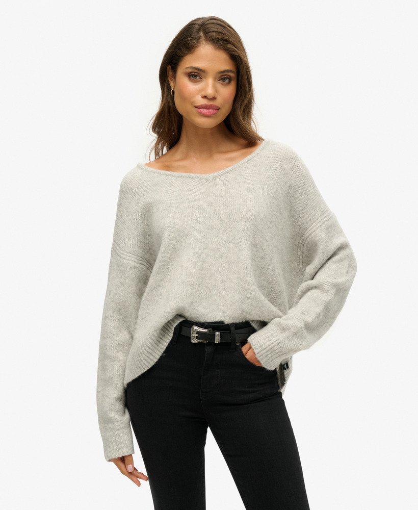 oversized v-hals trui in lichtgrijs met twist.