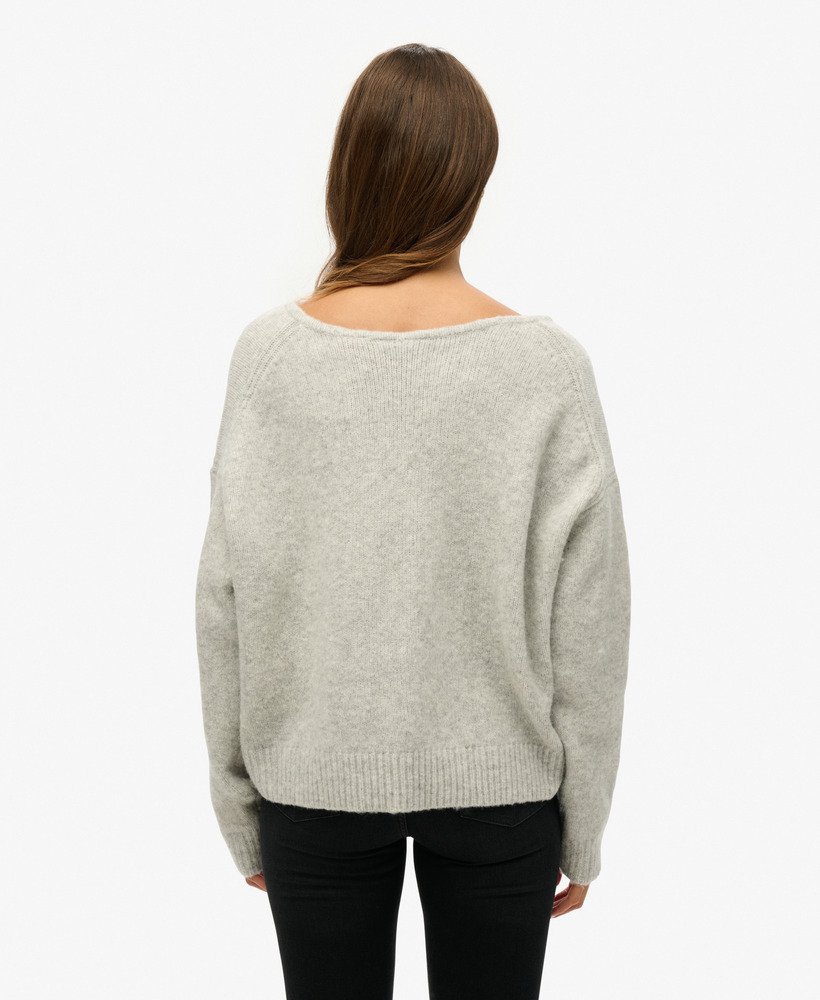 oversized v-hals trui in lichtgrijs met twist.