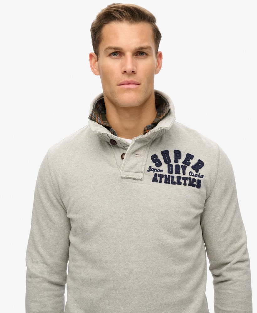 vintage sportieve halfknoops sweater in lichtgrijs gemêleerd.