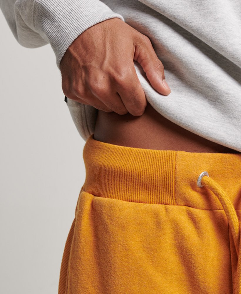 vintage jersey shorts met geborduurd logo in een goudkleurige gemêleerde stof.