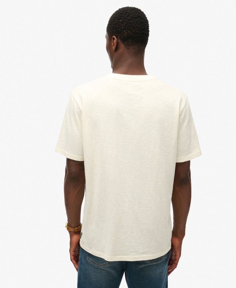 neonkleurig t-shirt met reisprint en losse pasvorm in gebroken wit met structuurverf.
