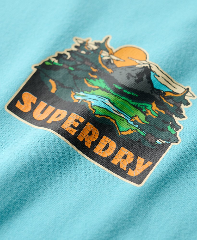 t-shirt met print van een reisansichtkaart op de borst in maui blue