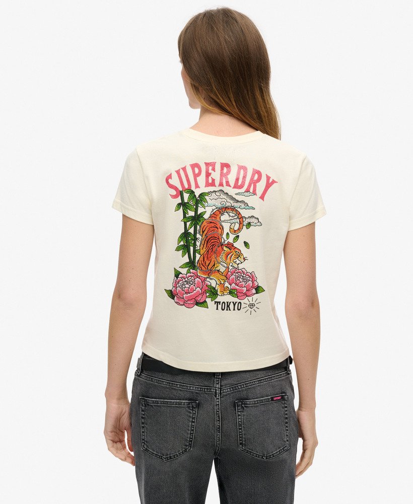 getailleerd t-shirt met tattoo- en strasssteentjes in rijstwit.