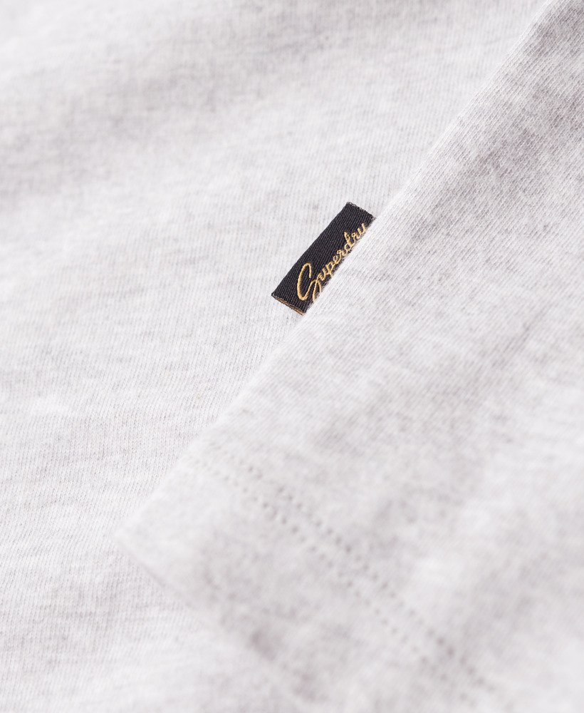 essential logo baseball top met lange mouwen in de kleur richest navyglacier grey marl.