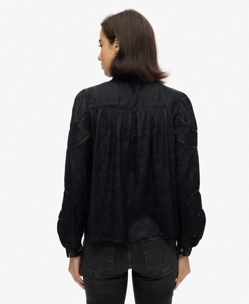 blouse met lange mouwen van geweven kant in zwart