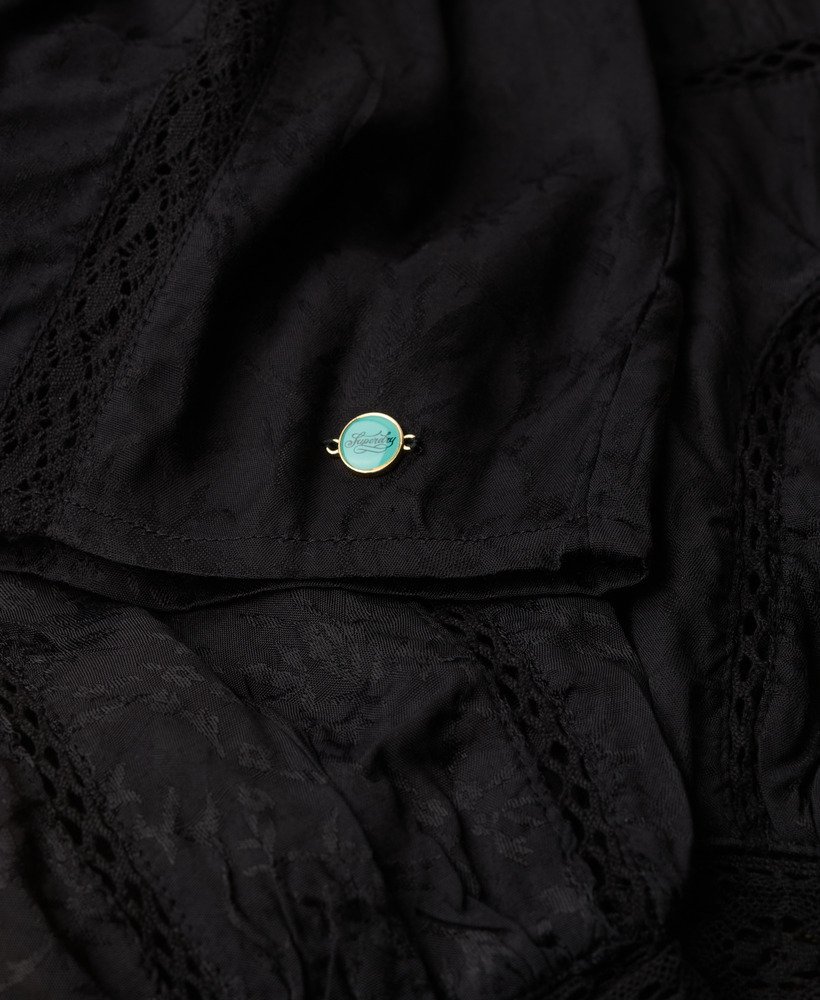 blouse met lange mouwen van geweven kant in zwart
