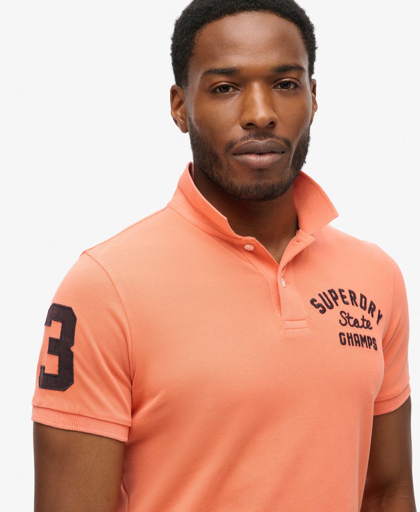 superstate poloshirt in sunburst coral