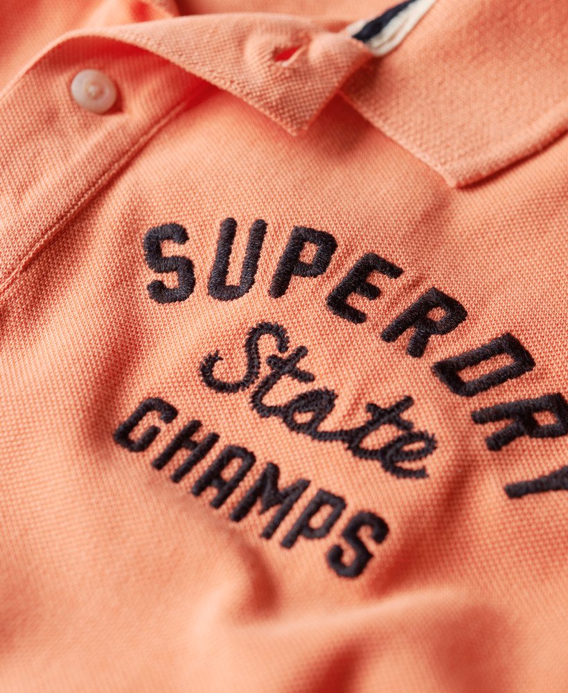 superstate poloshirt in sunburst coral