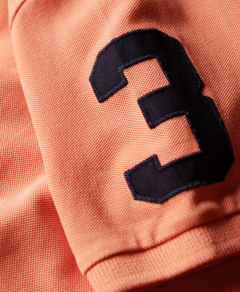 superstate poloshirt in sunburst coral