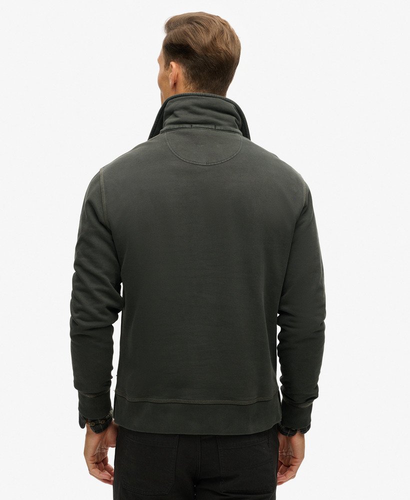 top met halve ritssluiting en contrasterende stiksels in gewassen zwart.